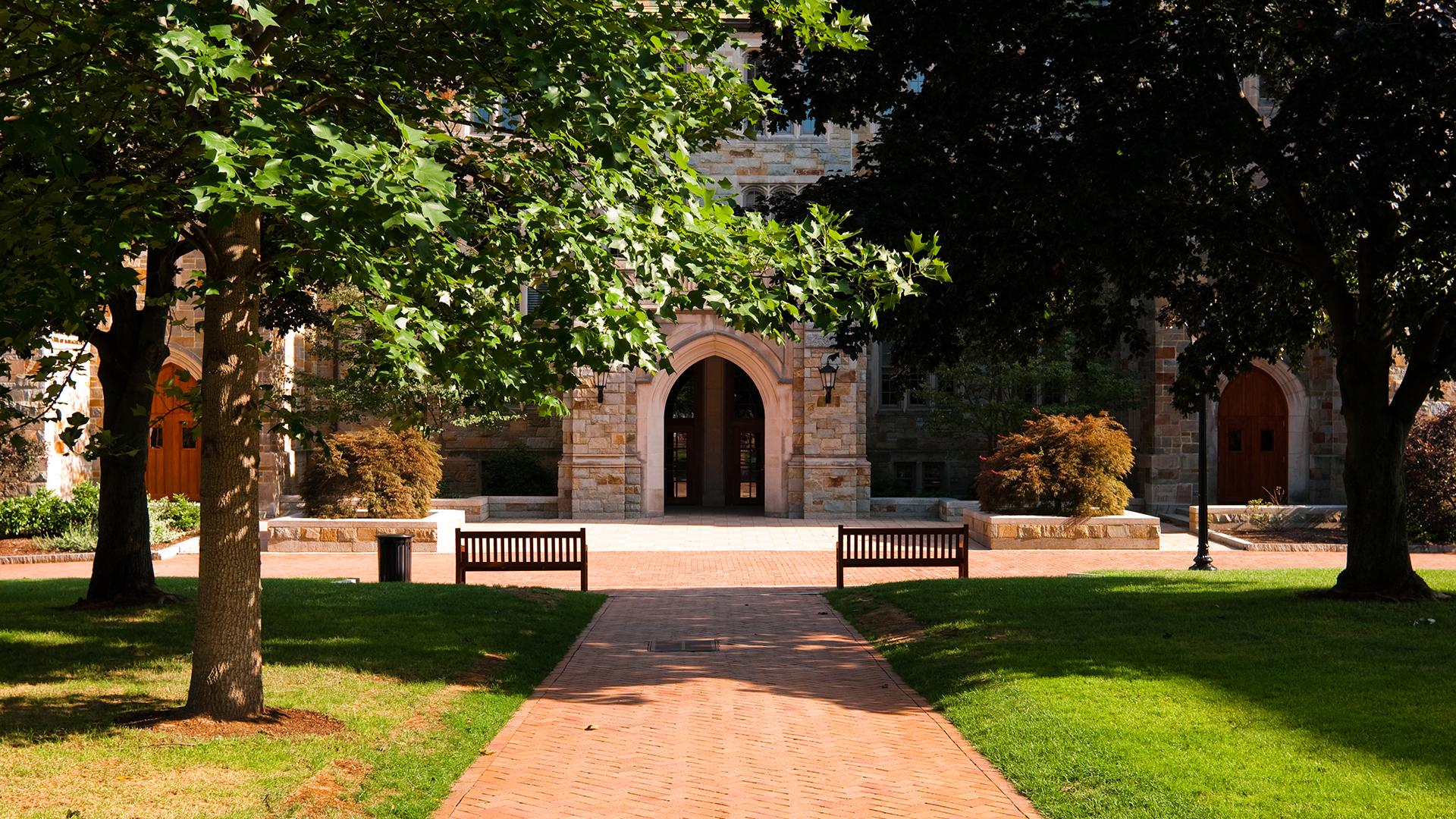Brick walkway leading to educational building at Boston College